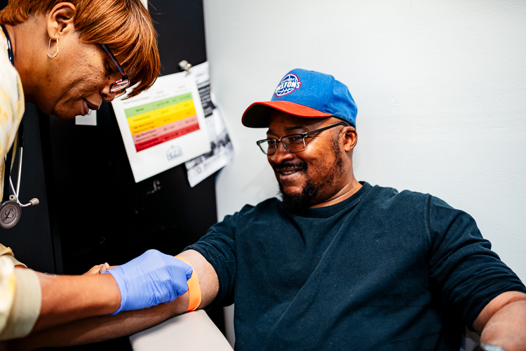 About HUDA Clinic | Detroit Community Health Center - william_butler_is_prepared_to_get_his_blood_drawn_by_his_nurse_val_gamble